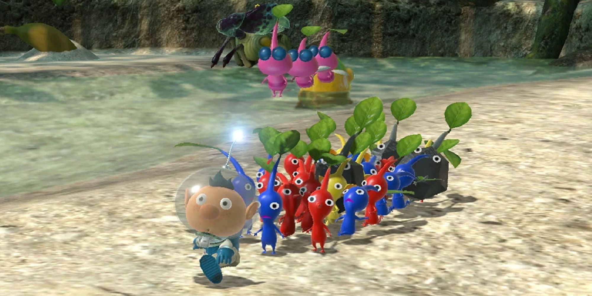 Alf walking along a lake with his Pikmin army in Pikmin 3