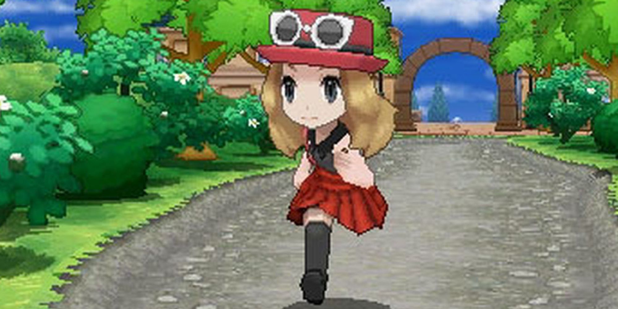 A female player running down a road in Pokemon X & Y