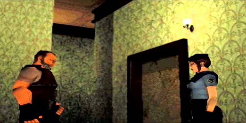 A still of Barry Burton and Jill Valentine as shown in the original port of Resident Evil, facing each other.