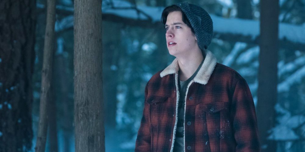Riverdale Jughead stands in the snowy woods