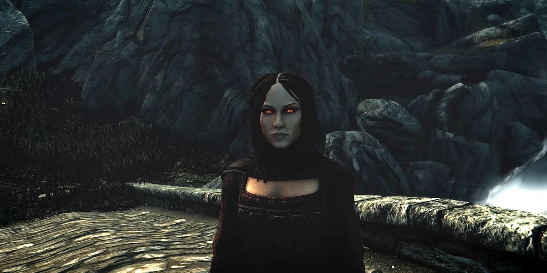Image from Skyrim showing Serana stood on a stone bridge.