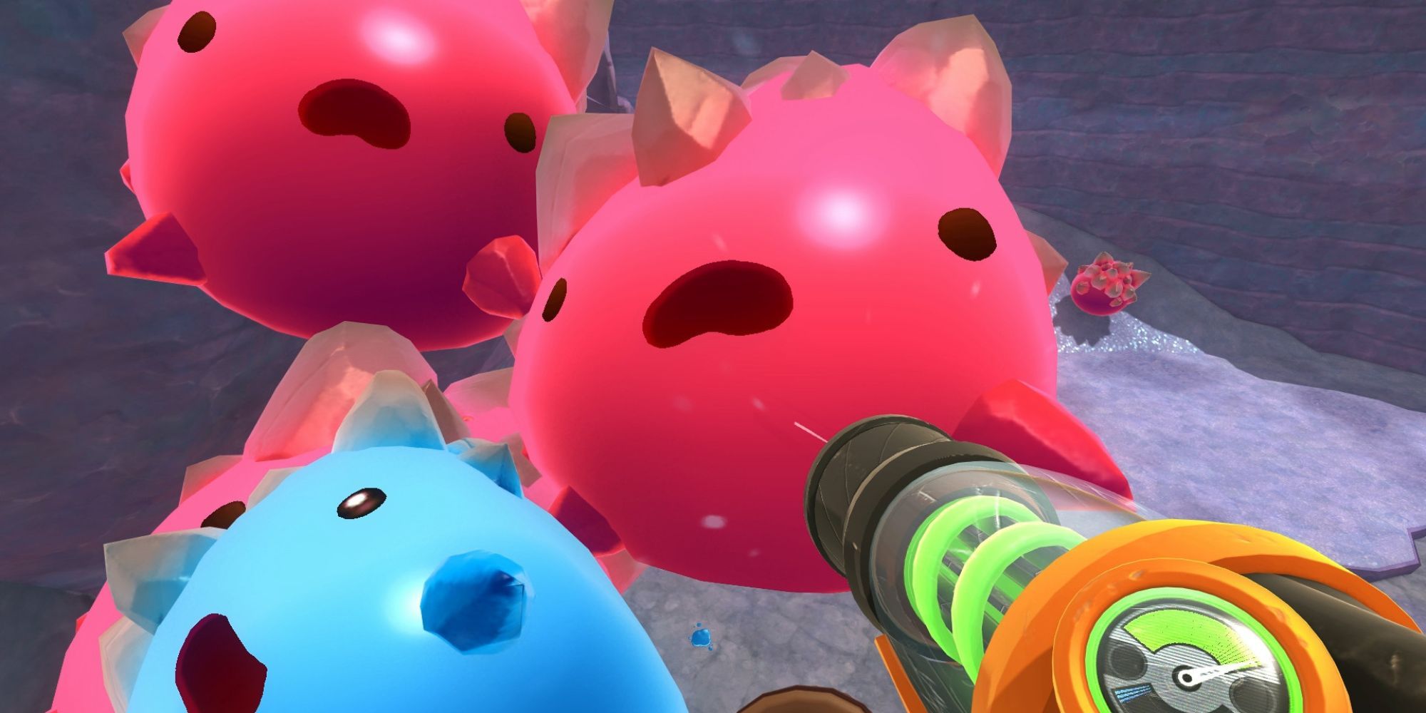 The player trying to suck up big slimes in Slime Rancher