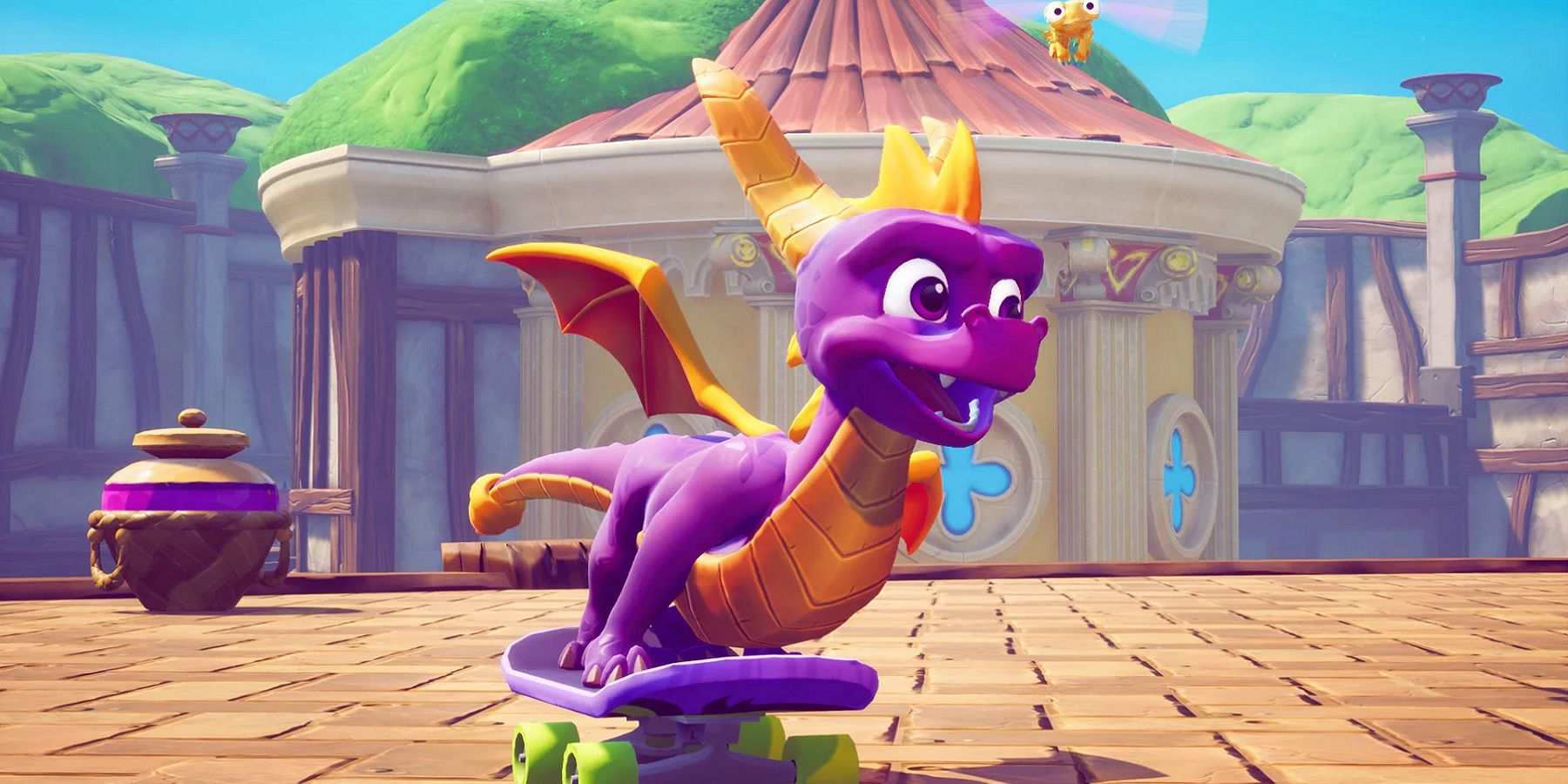 Spyro riding a skateboard with Sparx next to him