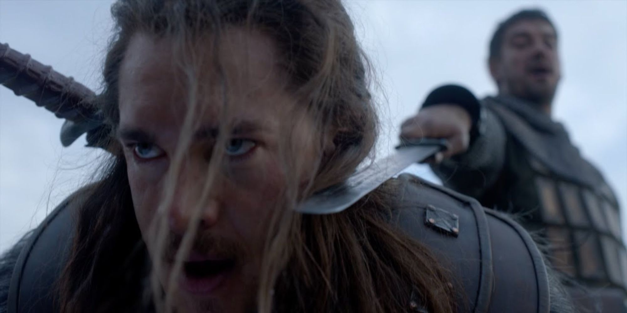 Leofric holds a sword to Uhtred's neck