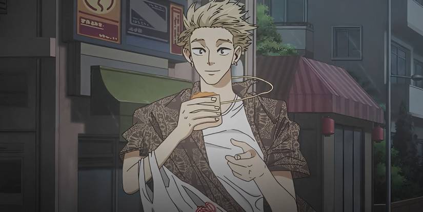 Masa standing outside on a windy day