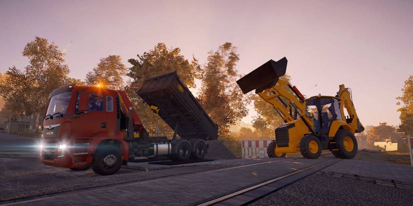 Wheel Loader And Dump Truck Working On The Road