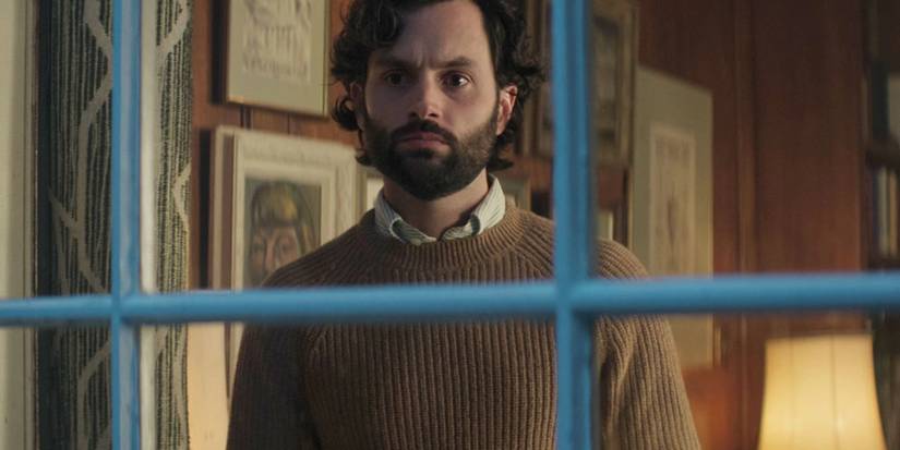 Penn Badgley as Joe Goldberg staring out the window in season 4 of You