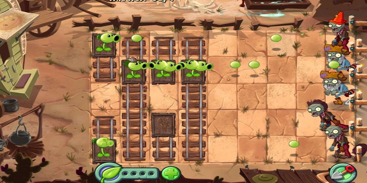 Pea shooters attacking zombies while on tracks in Plants Vs. Zombies 2: It's About Time