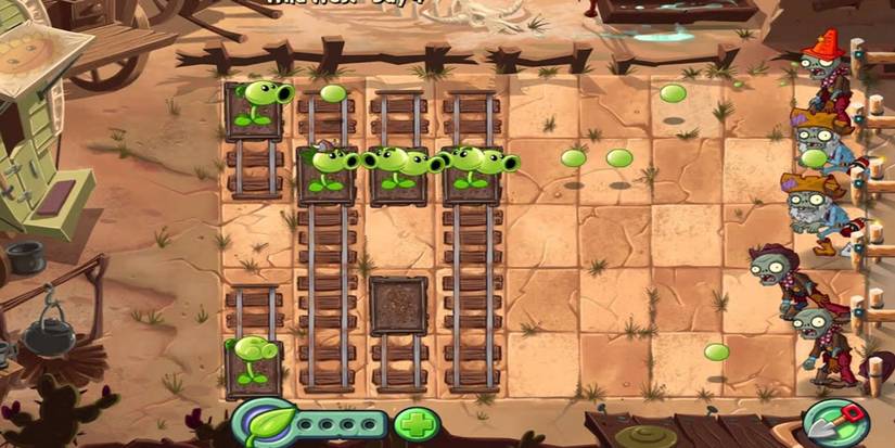 Pea shooters attacking zombies while on tracks in Plants Vs. Zombies 2: It's About Time