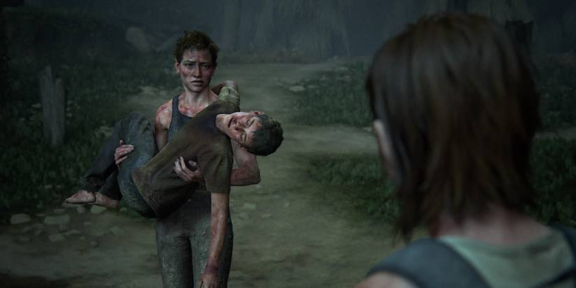 Ellie staring at Abby carrying Lev