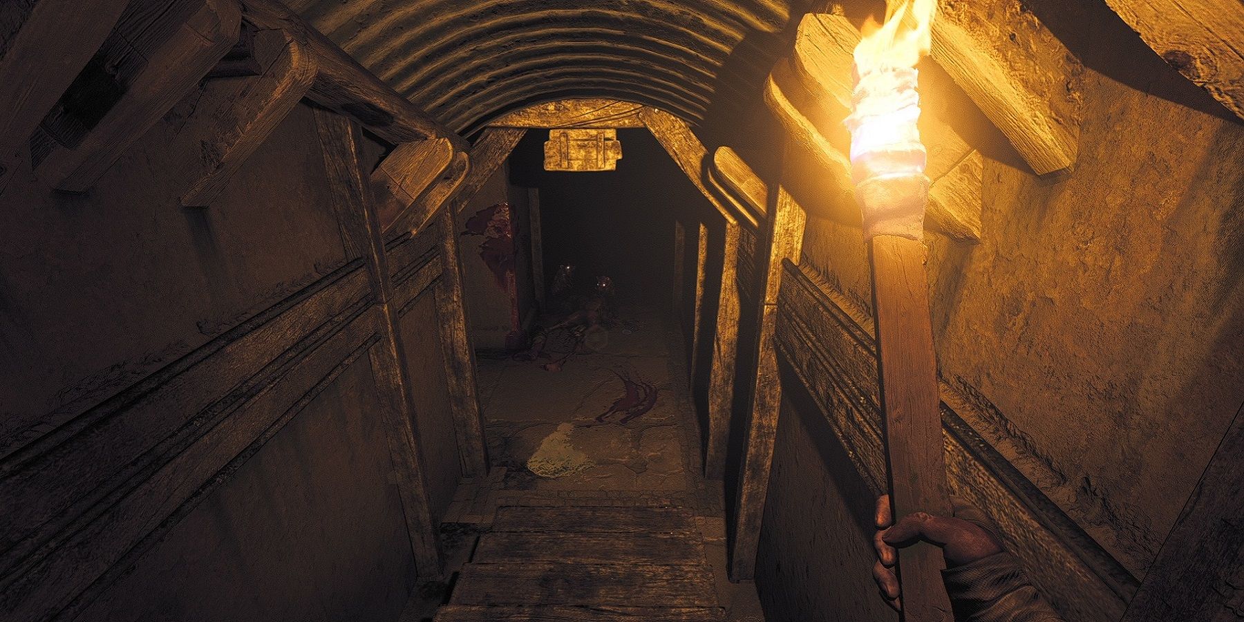 Image from Amnesia: The Bunker showing the player lighting up a dark hallway.