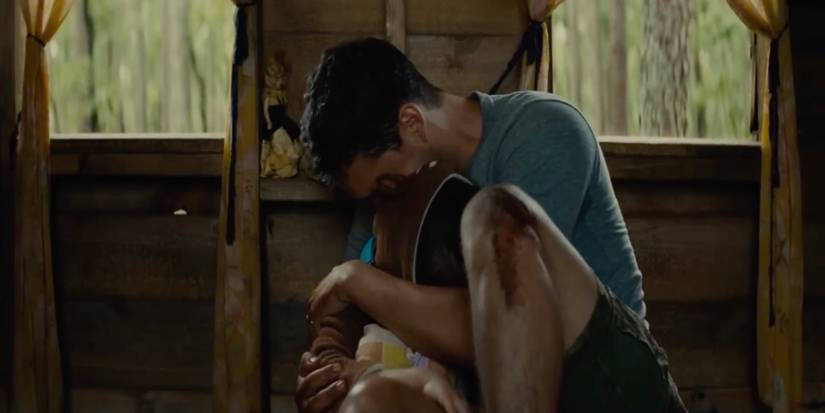 Andrew hugging Wen in Knock at the Cabin