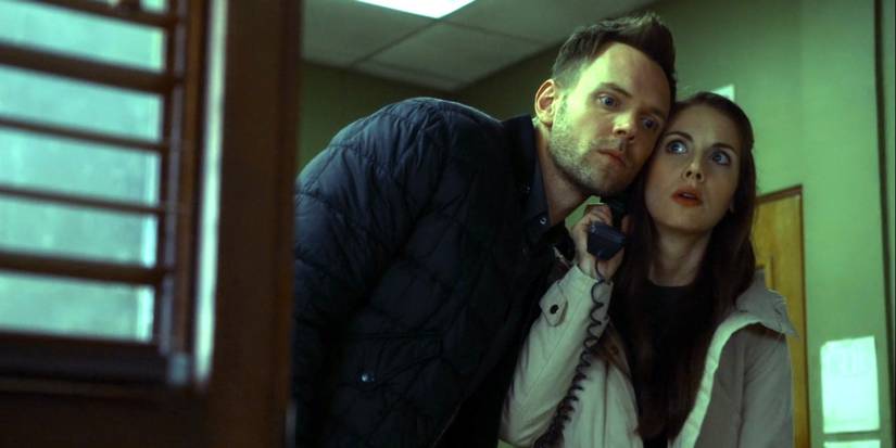 Jeff and Annie sharing a phone