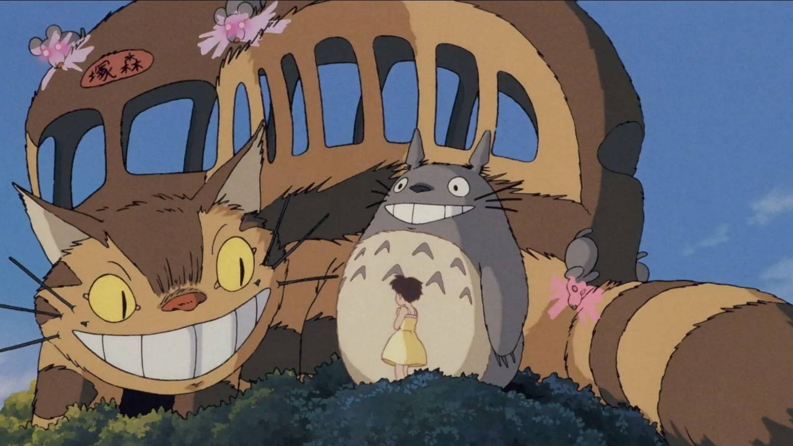 The Catbus, Satsuki, and Totoro standing in a tree
