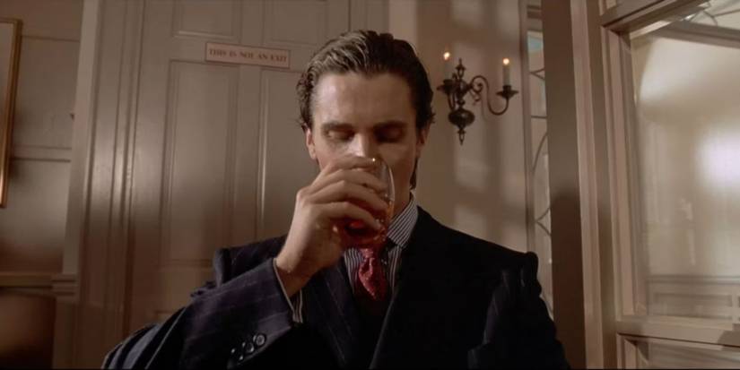 Christian Bale drinking in American Psycho ending