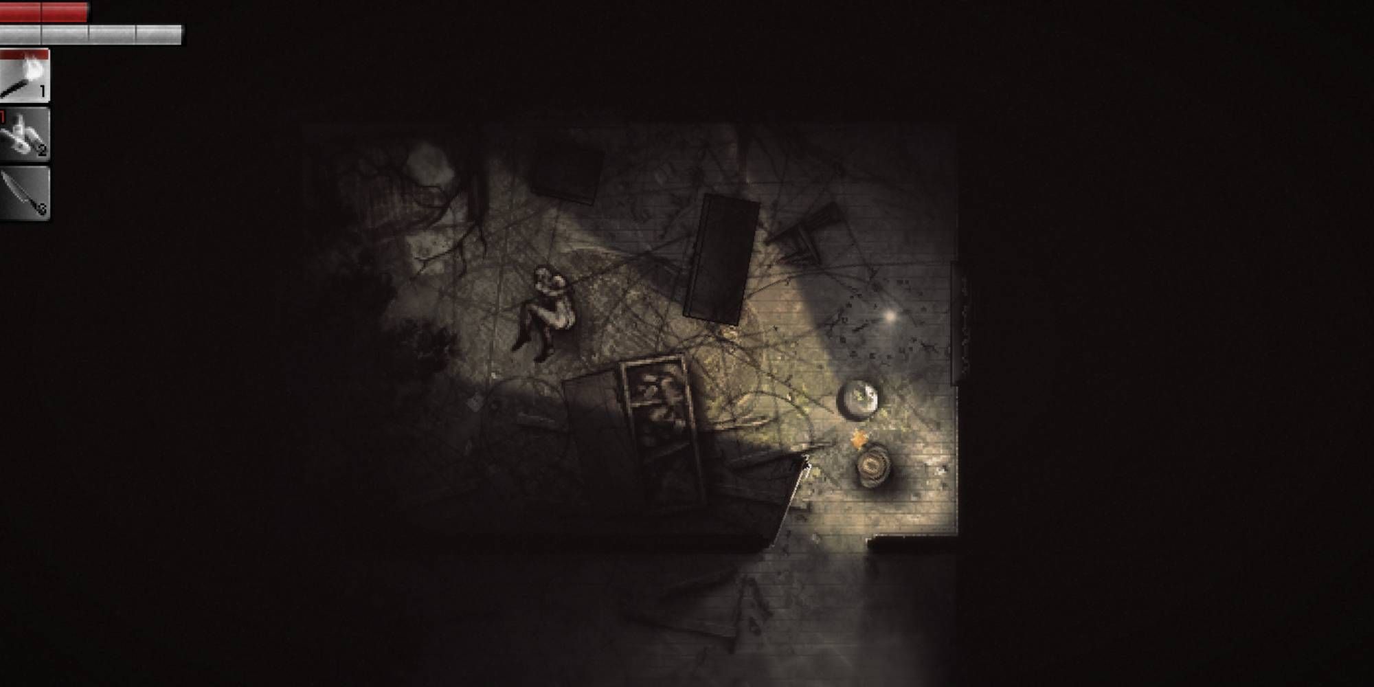 The player's in game view within a dark room that contains some overturned furniture, lit only by a handheld light