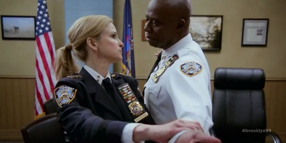 Madeline Wuntch patting down Raymond Holt to check for wires in brooklyn nine-nine