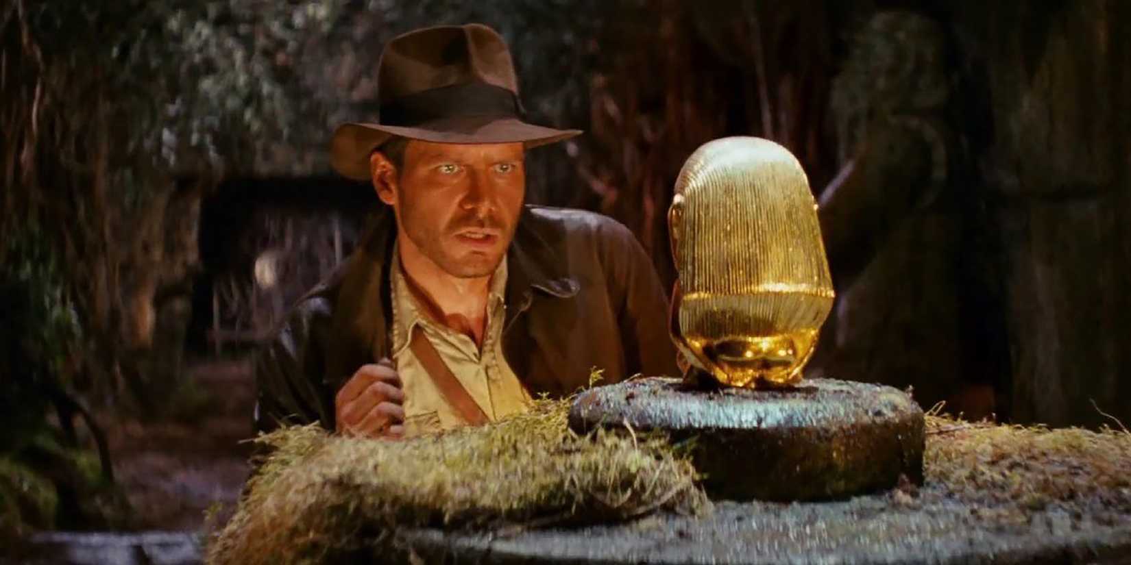 Indiana Jones looking at the treasure in Raiders of The Lost Ark