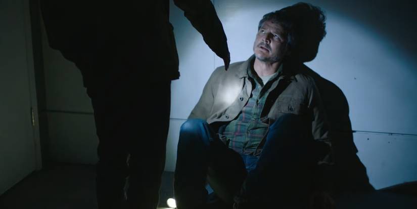 Ellie holds out her hand for Joel in The Last of Us.