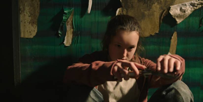 Ellie playing with her pocket knife in The Last of Us.