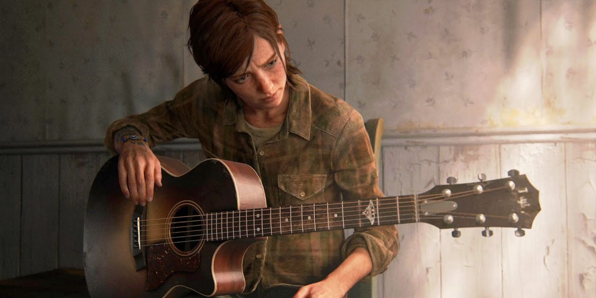 Ellie playing Joel's guitar