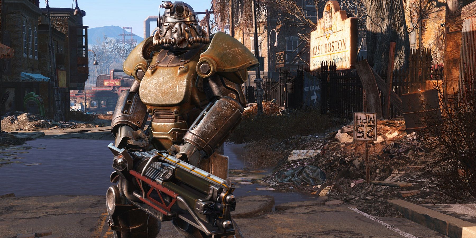 Screenshot from Fallout 4 showing a member of the Brotherhood of Steel holding a gatling laser.