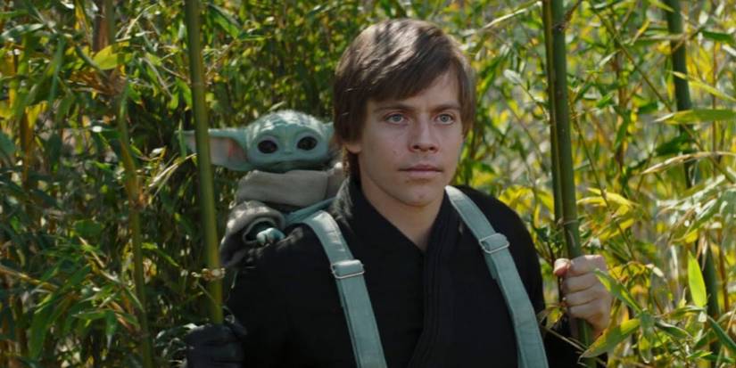 Grogu and Mark Hamill CGI Luke Skywalker in a forest The Book of Boba Fett