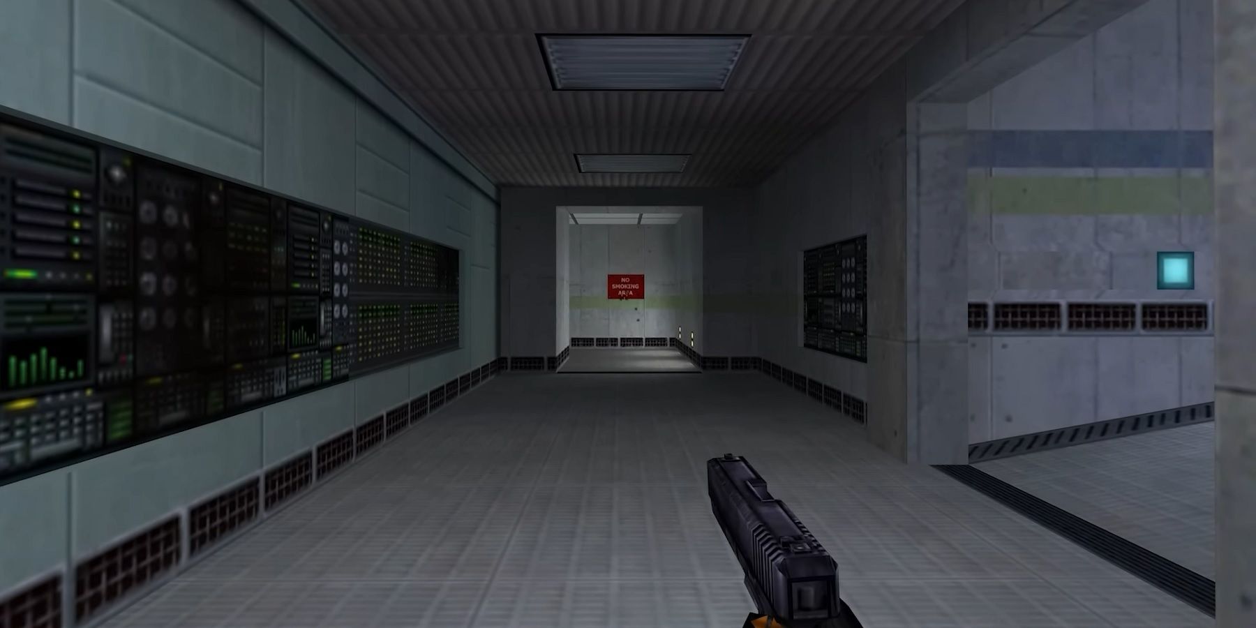 Image from Half-Life showing the player holding a pistol as they walk down a corridor.