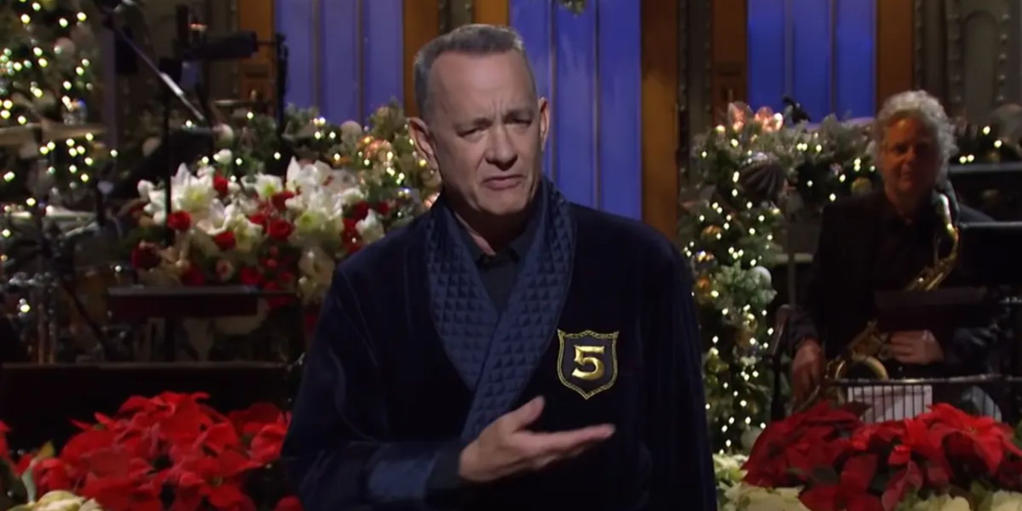 Tom Hanks wearing his 5-Timer Club robe in a monologue