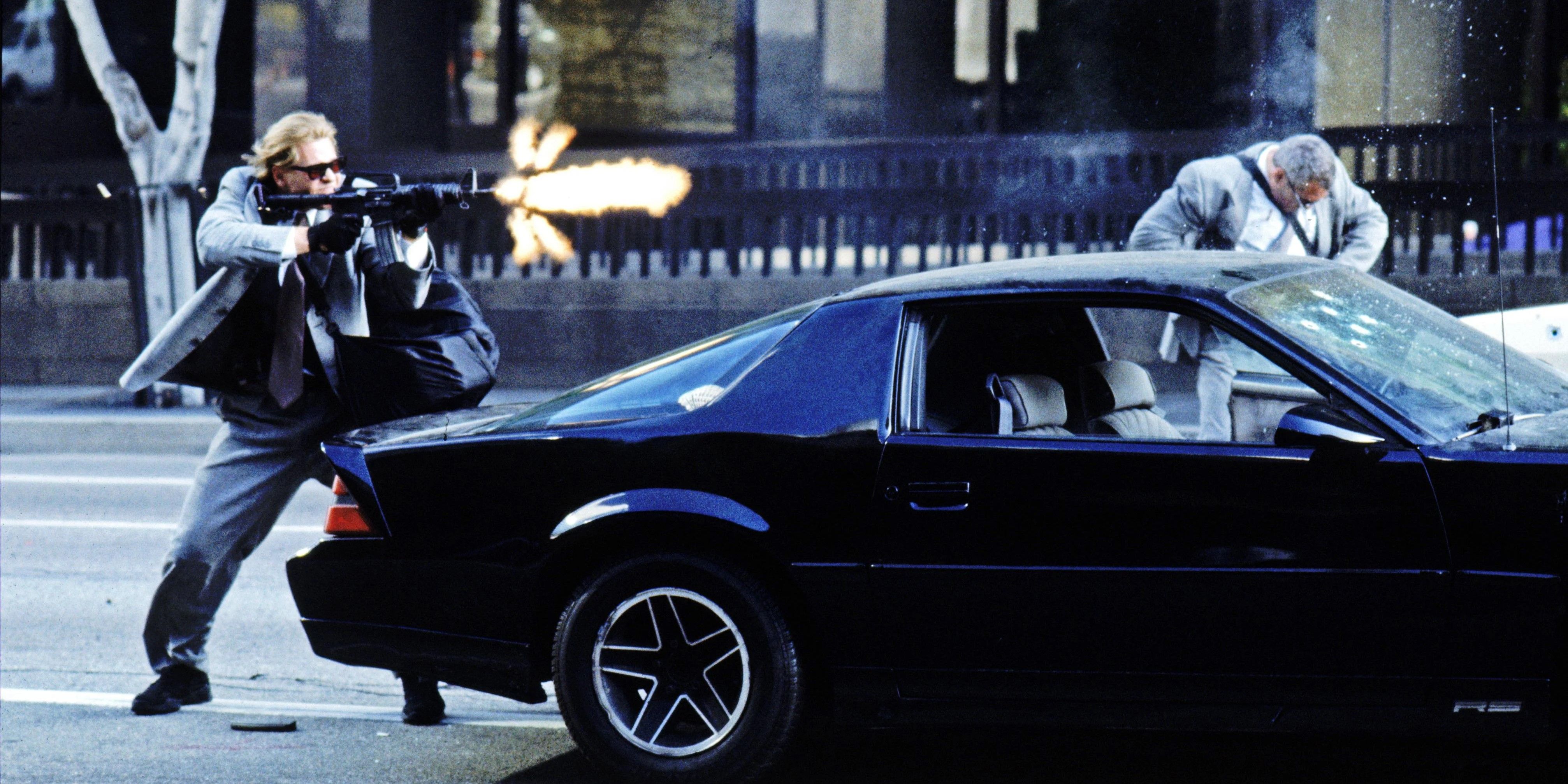 Chris (Val Kilmer) shooting a rifle in Heat (1995).