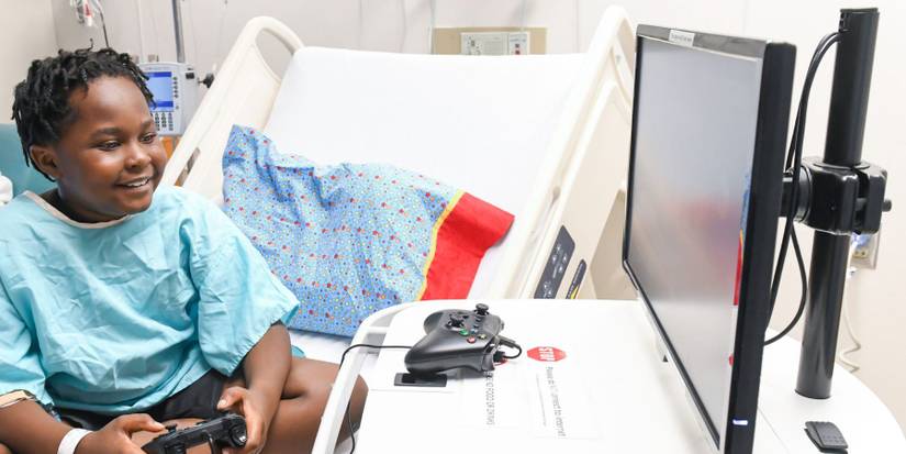 Hospital patient with Gamers Outreach GO-Kart