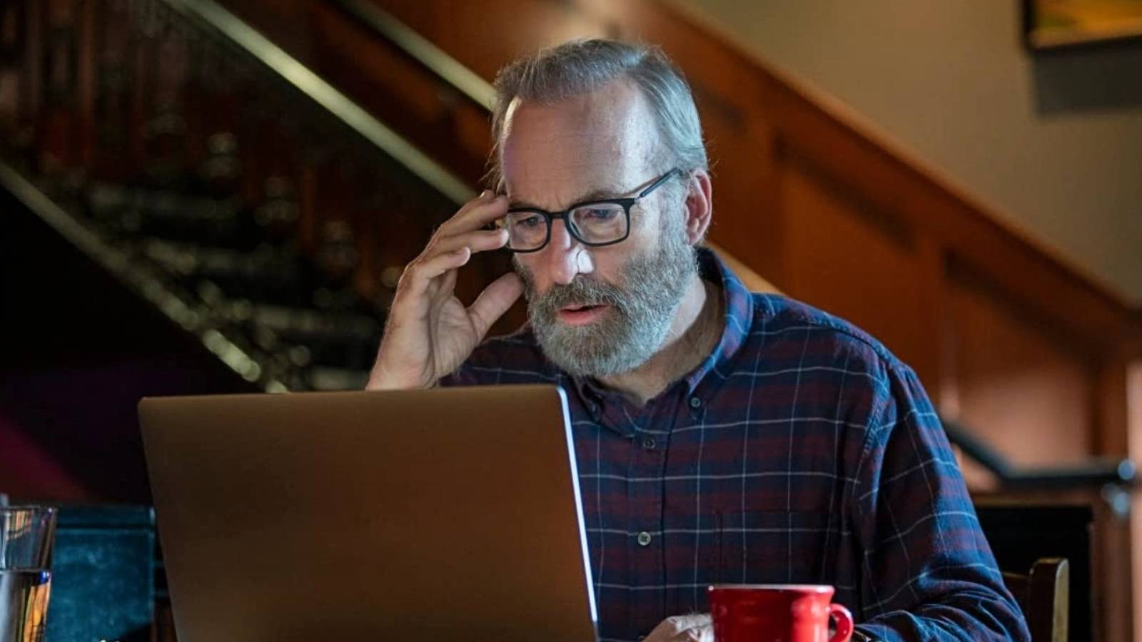 Bob Odenkirk in front of laptop in Lucky Hank