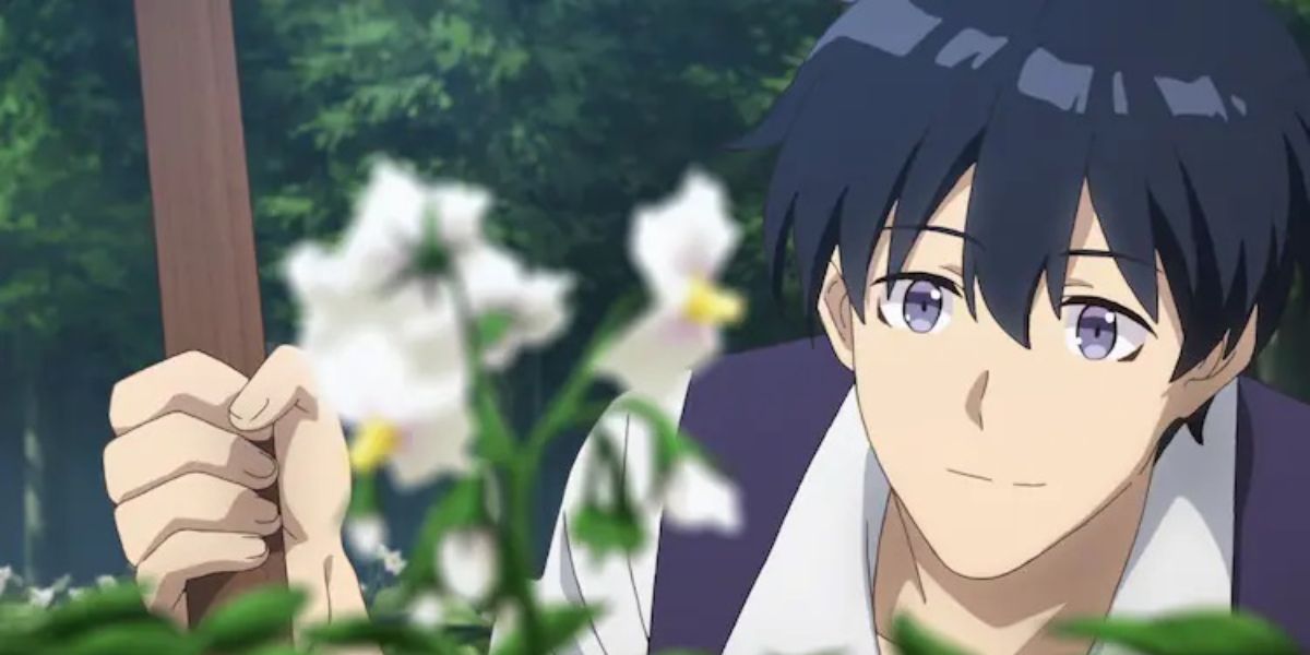 Machio Hiraku looking at a flower