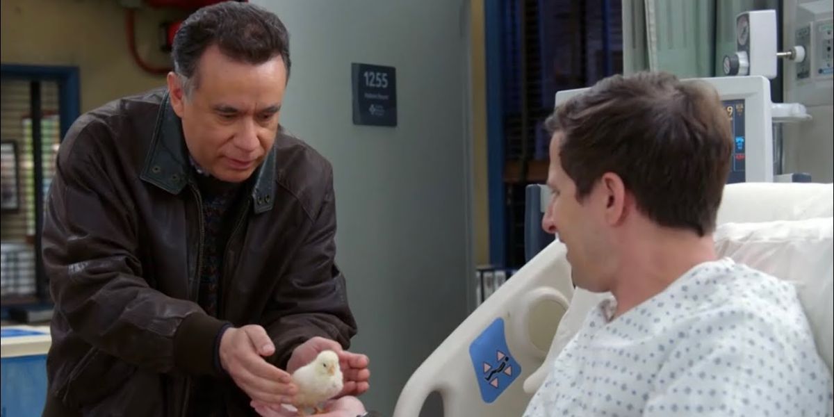 Melipnos handing a baby chicken to Jake Peralta