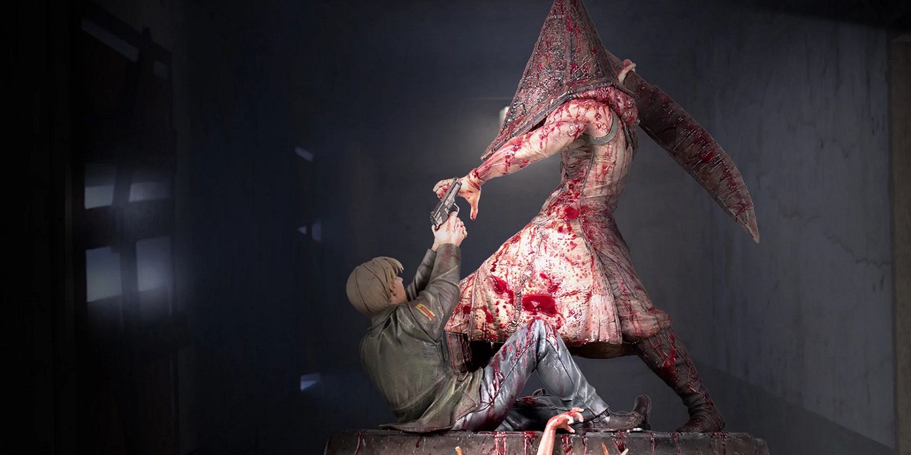 Image of a statue from Silent Hill 2 showing James Sunderland fighting Pyramid Head.