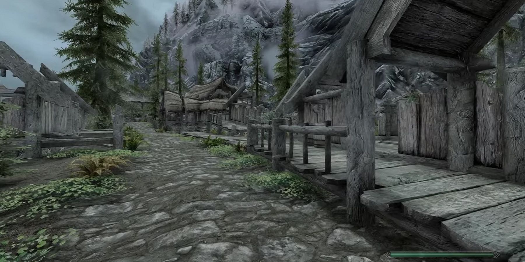 Image from Skyrim showing an empty Riverwood with dilapidated buildings.