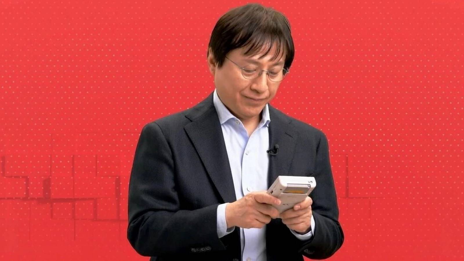 Shinya Takahashi playing on a Game Boy during the February 2023 Nintendo Direct
