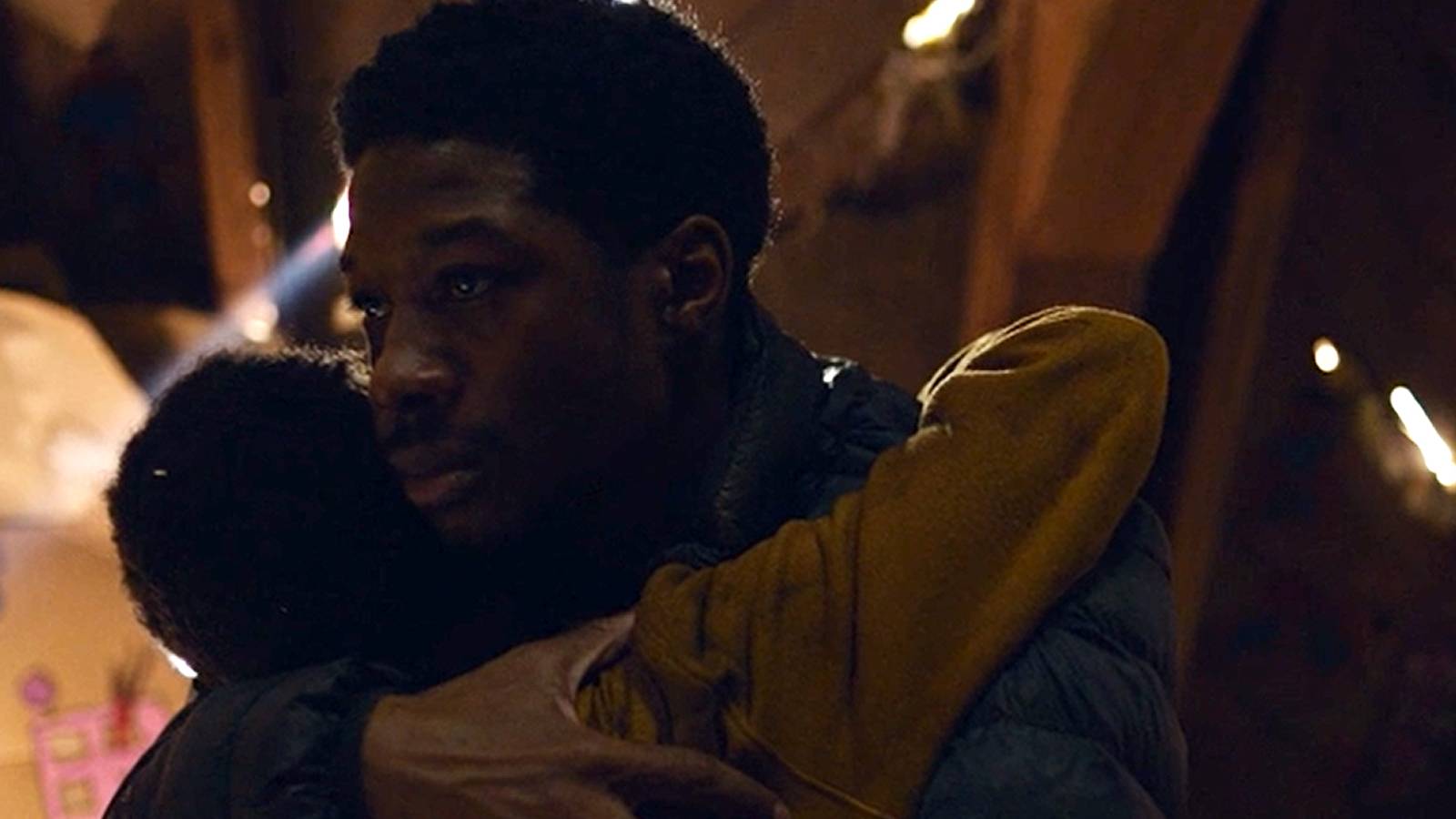 Henry and Sam hugging in The Last of Us.