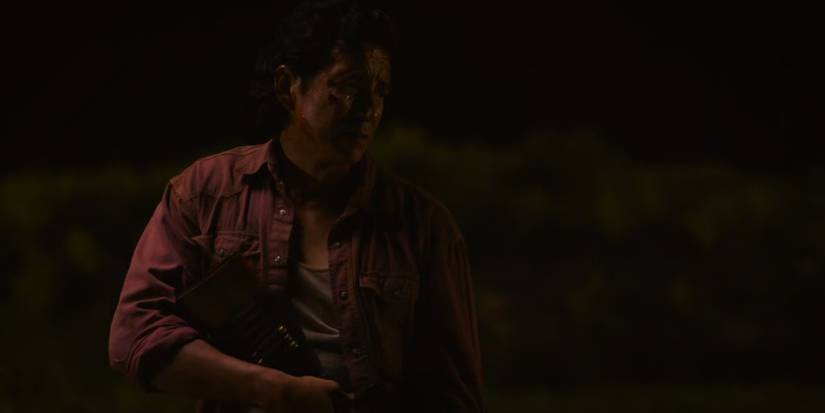 Tommy Miller holding a rifle in HBO's The Last Of Us.