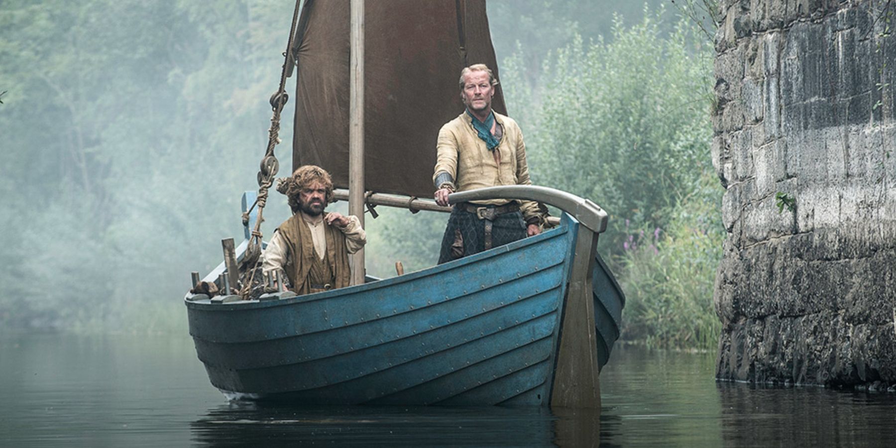 Tyrion Lannister and Ser Jorah sailing through the ruins of Valyria in Game of Thrones.