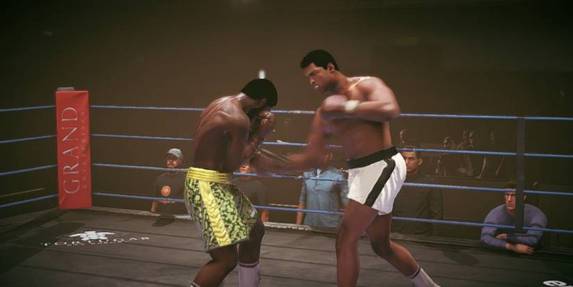 Undisputed Frazier blocking a hook to the body-1