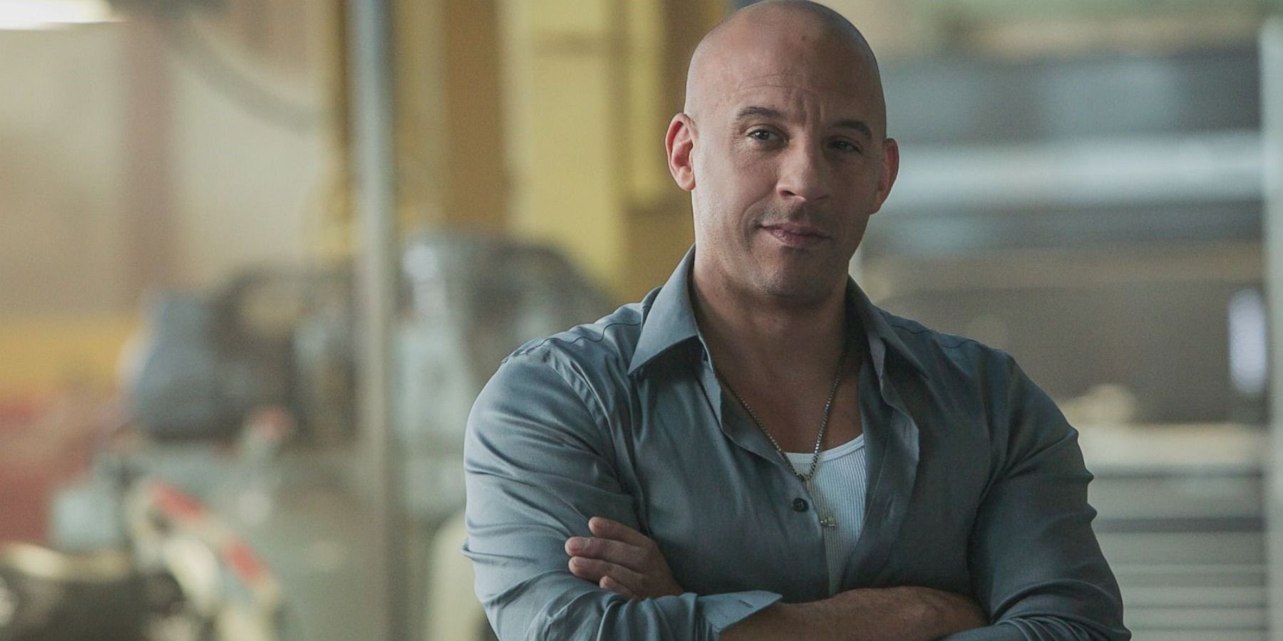 Vin Diesel as Dominic Toretto with arms crossed in Fast and Furious
