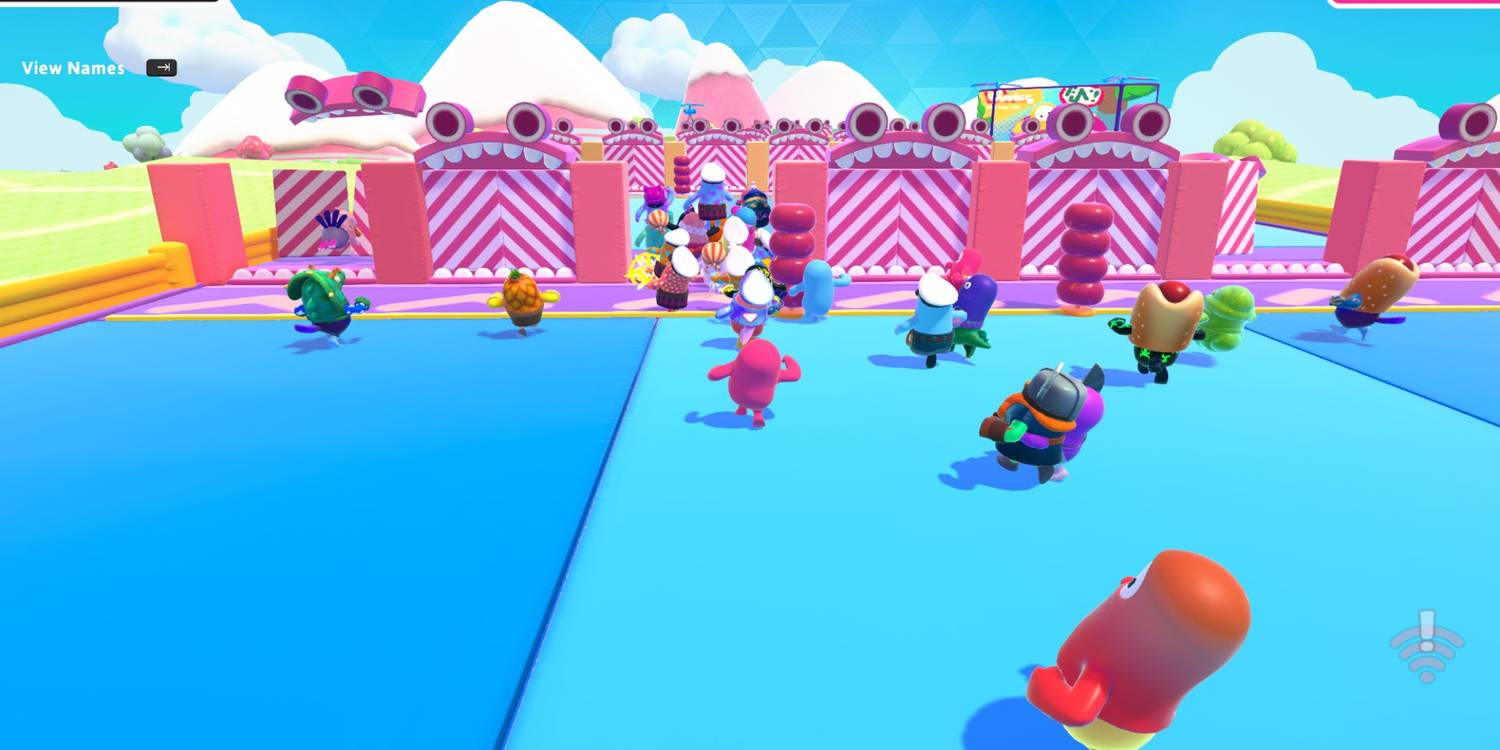 A first round in fall guys, where players have to knock through doors to progress