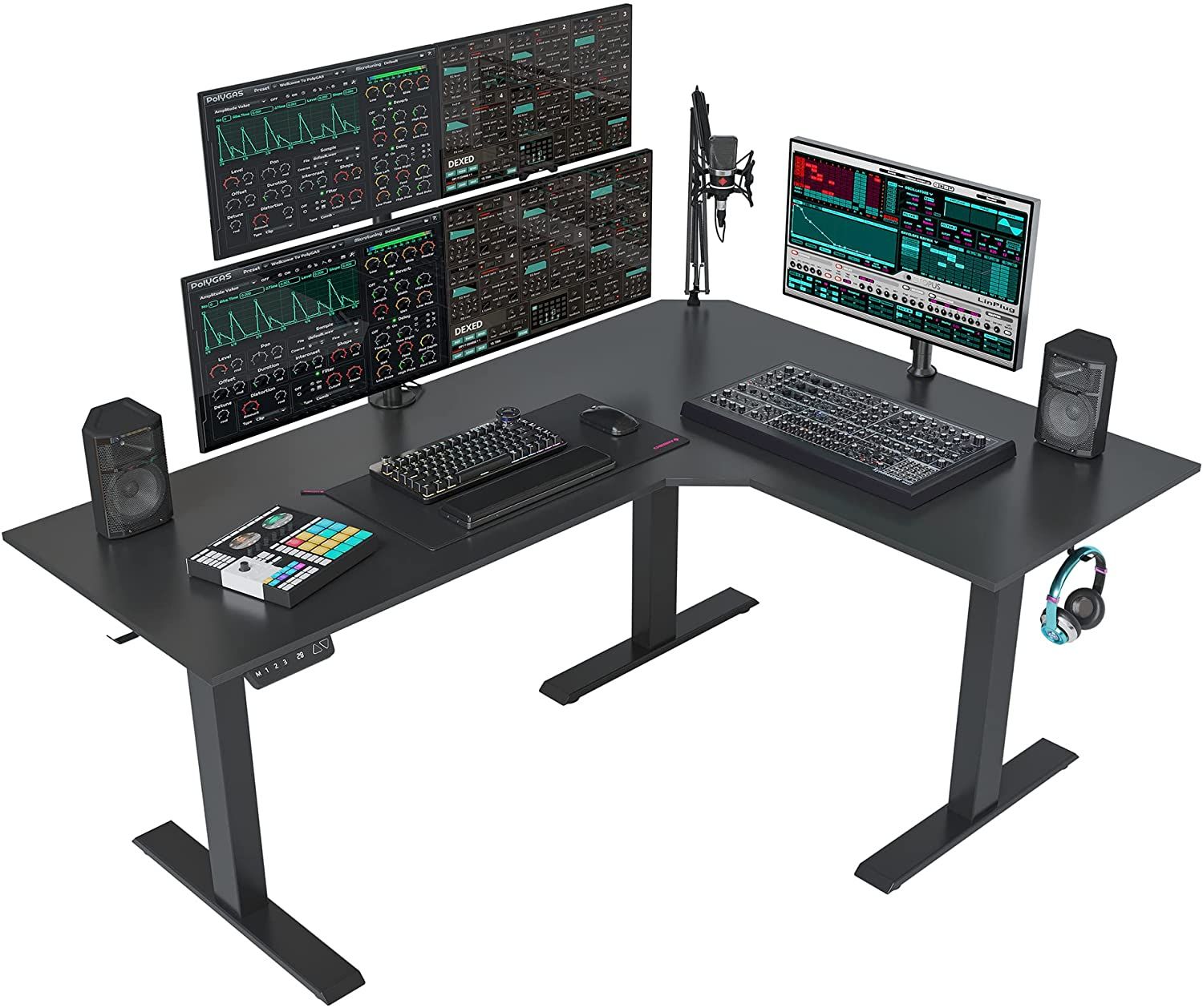 The FEZIBO Triple Motor L-Shaped Electric Standing Desk with computer and sound equipment on top of it.