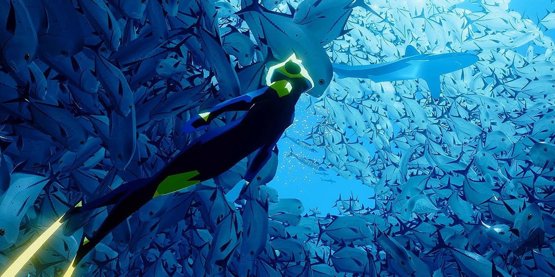 Screenshot of diver in Abzu swimming up toward a shoal of fish