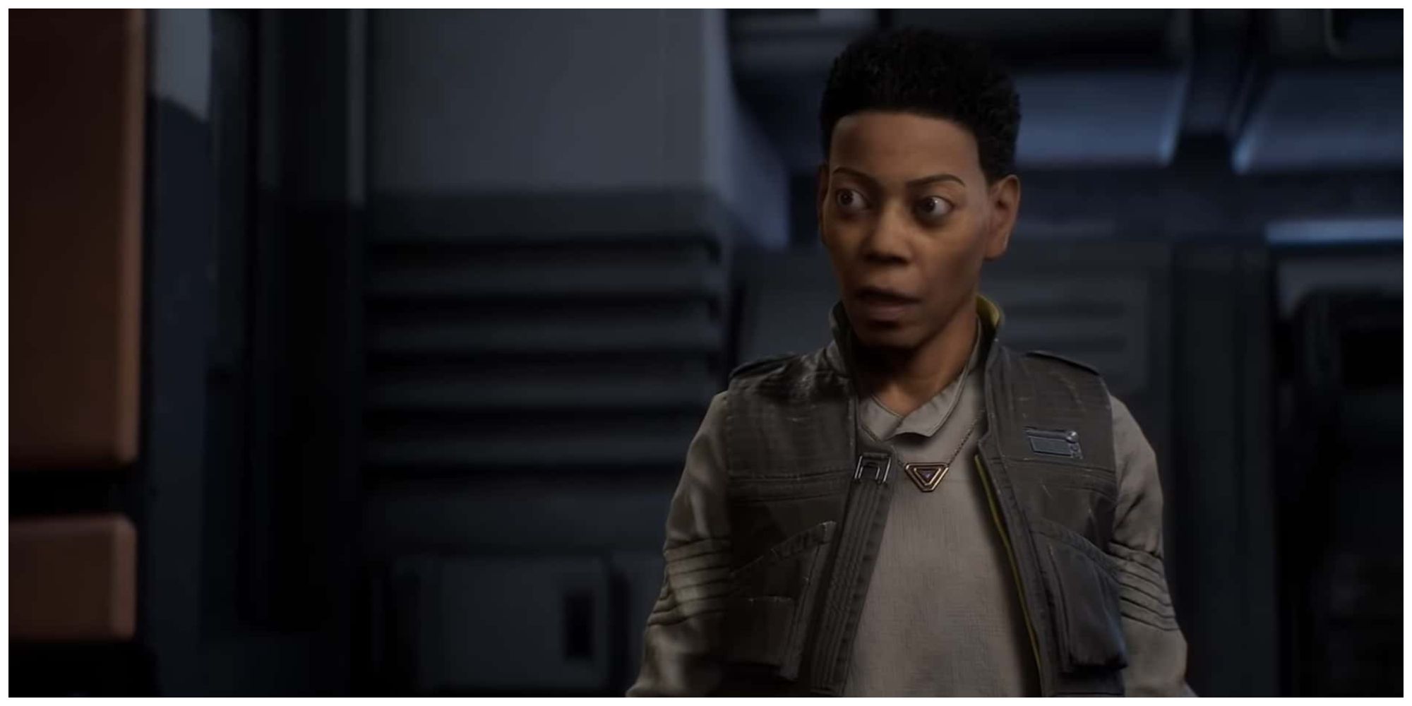 Cere Junda from Star Wars Jedi: Fallen Order wearing a grey shirt and dark vest. She has a stern look on her face.