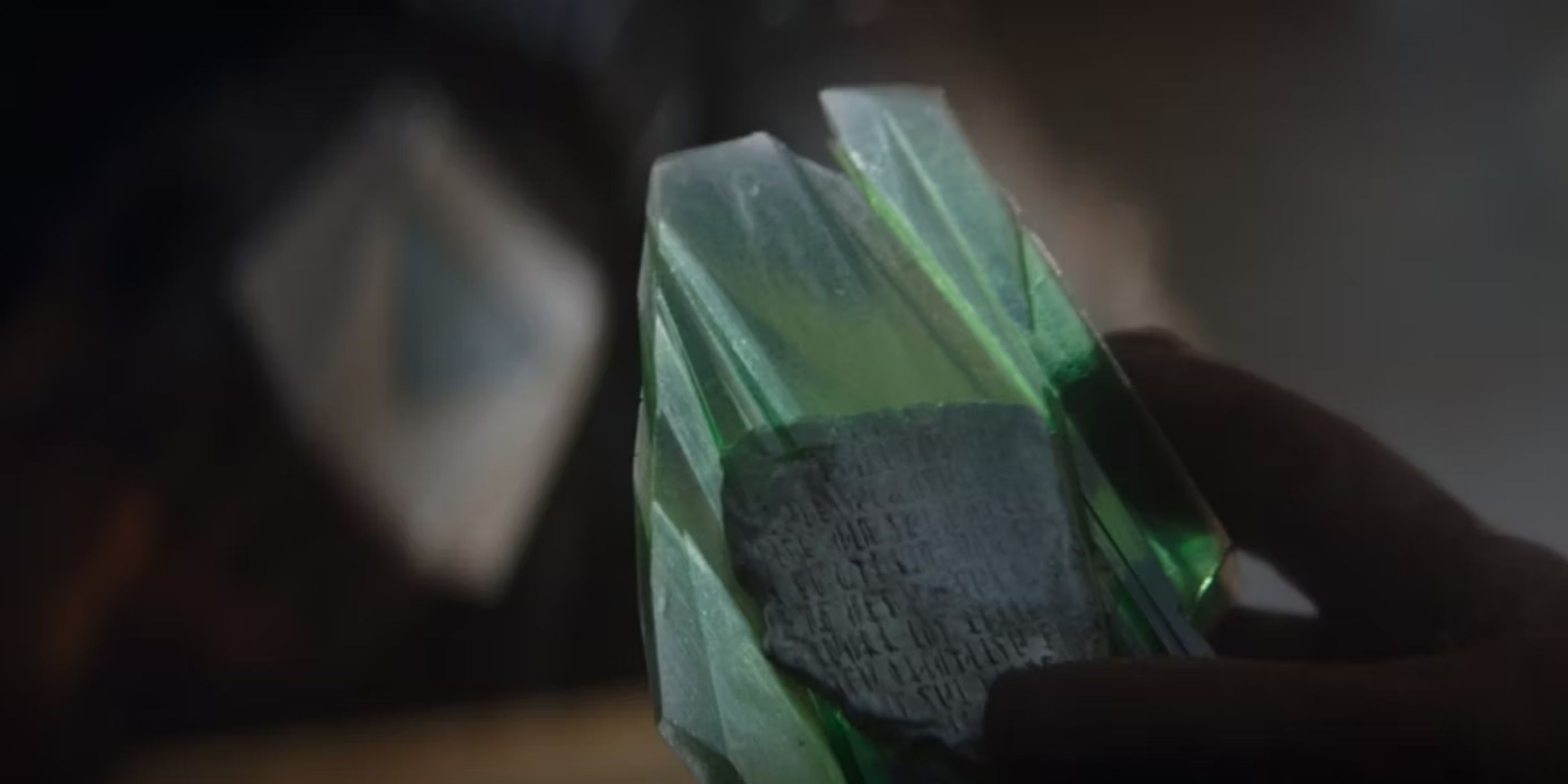 mandalorian text on a green crystal