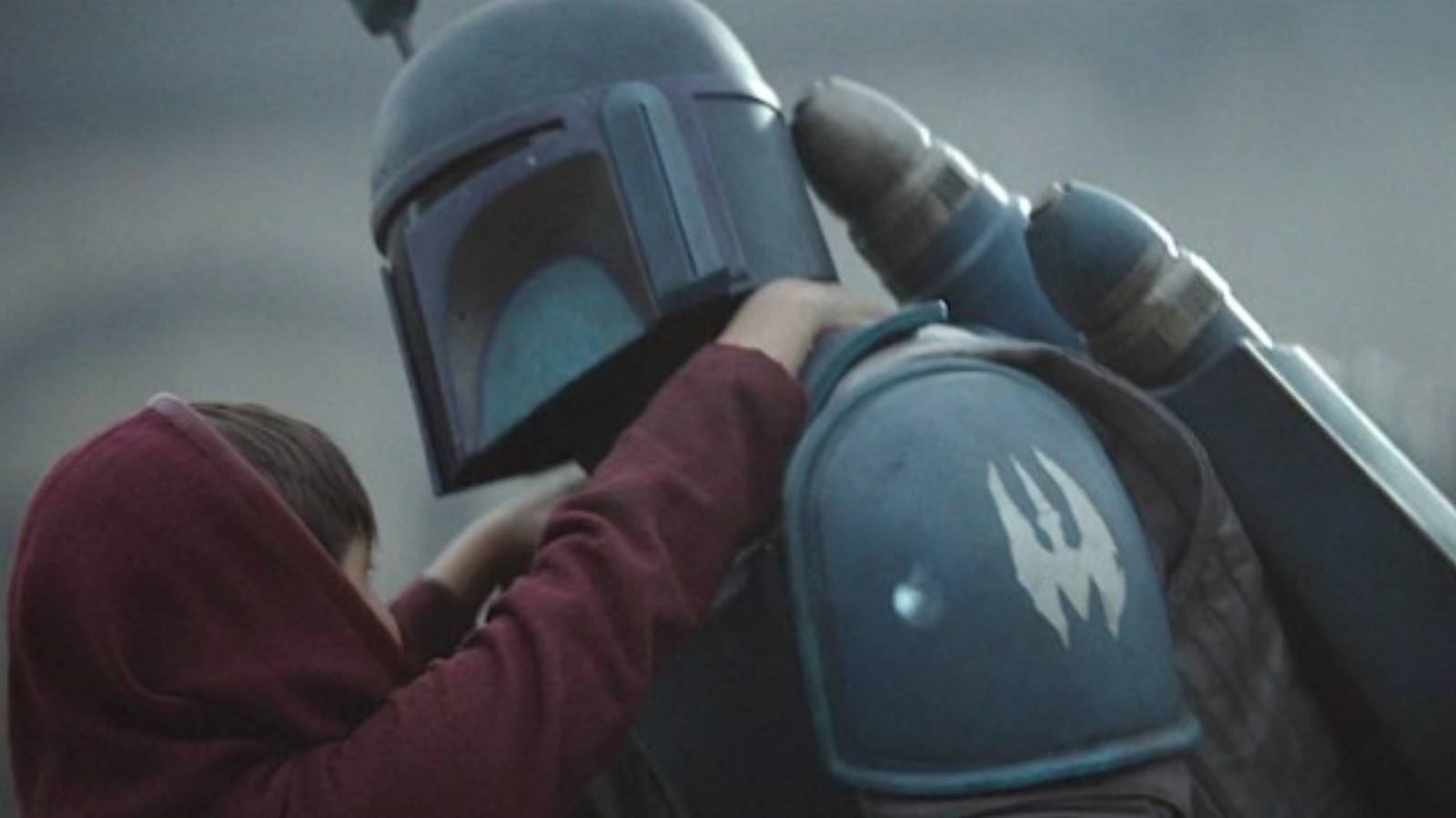 a death watch mandalorian rescuing young din djarin