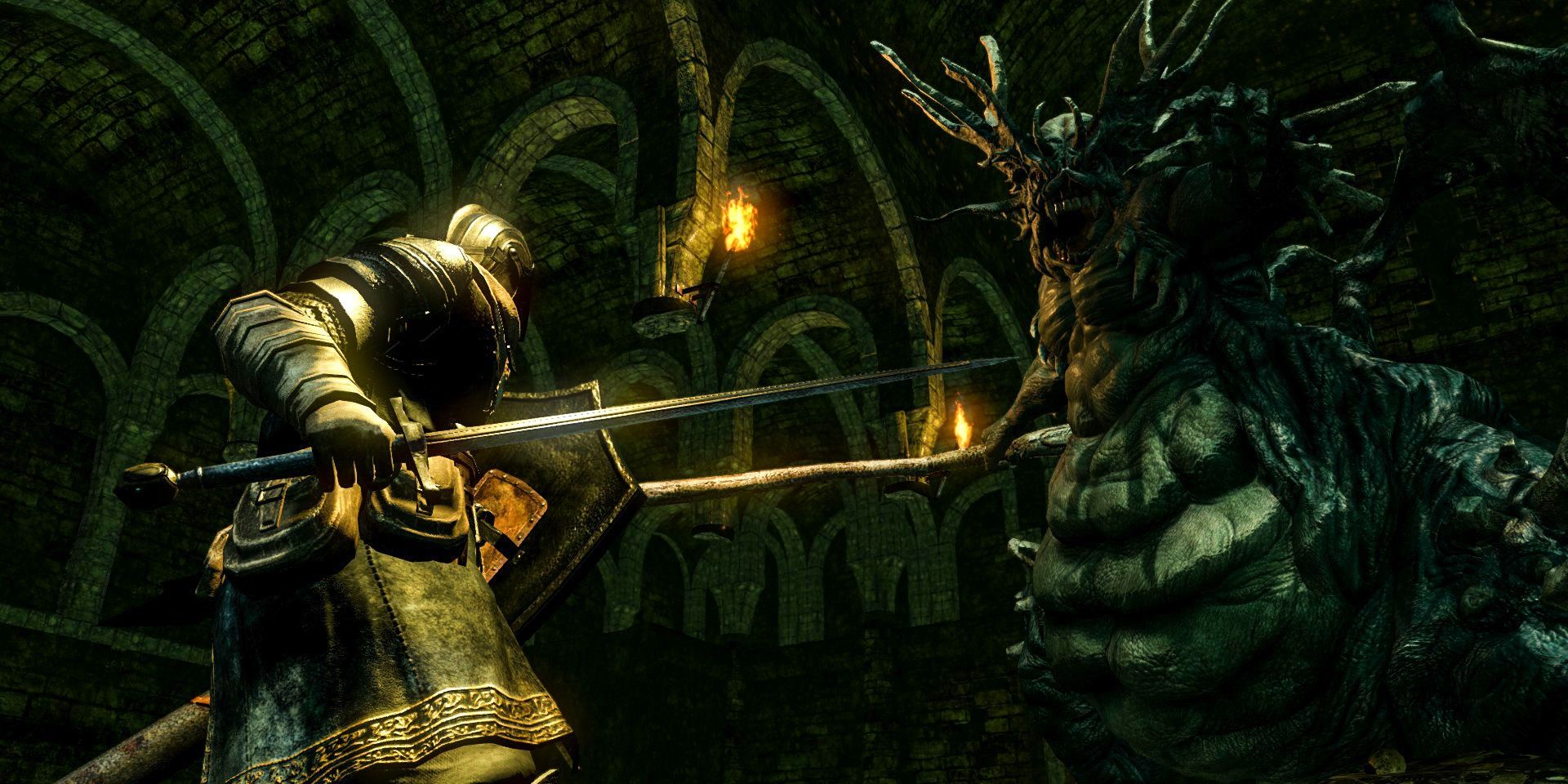 A player with their sword out about to face a boss in Dark Souls