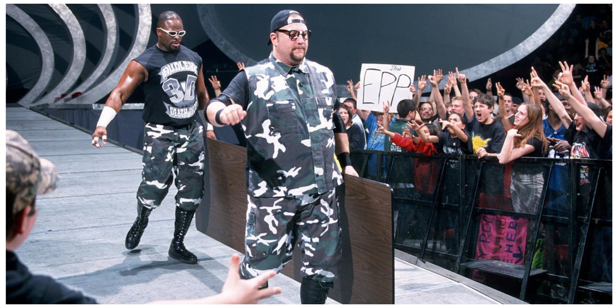 Bubba Ray and D-Von Dudley carrying a table down the entrance ramp on WWE SmackDown